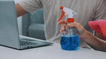 Woman cleaning table using rag and diffuser at home. video