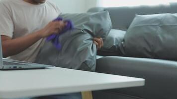 Woman cleaning table using rag and diffuser at home. video