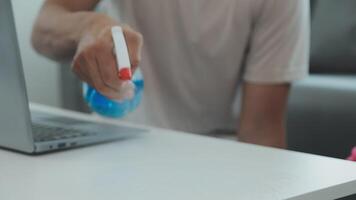 Woman cleaning table using rag and diffuser at home. video