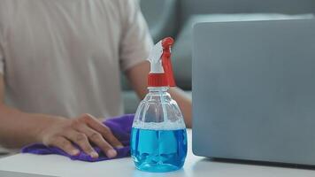 Woman cleaning table using rag and diffuser at home. video