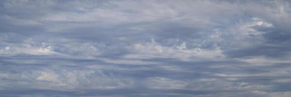 gray sky with stormy dramatic clouds - panorama photo