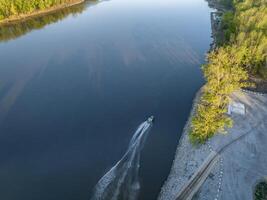 fishing boat leaving a ramp - sunrise aerial view of Missouri River at Dalton Bottom photo