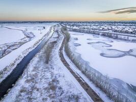 irrigation channel, bike trail and frozen pond photo