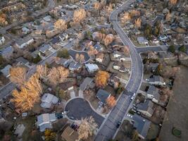 winter morning over a residential street in Fort Collins in northern Colorado, aerial view photo