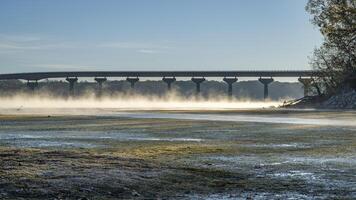 Natchez National Parkway - bridge over Tennessee River from Tennessee to Alabama, foggy November sunrise photo