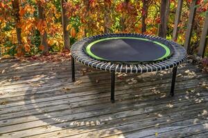 mini fitness trampoline in backyard patio photo