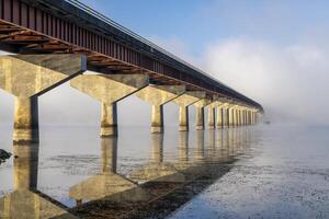 Natchez National Parkway - bridge over Tennessee River from Tennessee to Alabama, foggy November sunrise photo