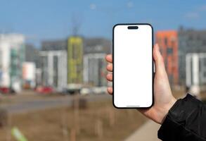 Berlin Germany January 21 2024 Hand holding mobile phone screen mockup, empty blank smartphone photo