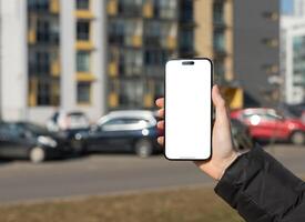 Berlin Germany January 21 2024 Hand holds mobile phone screen mockup, empty blank iphone smartphone photo