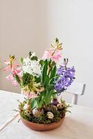 Easter composition from hyacinths flowers and quail eggs on linen tablecloth. Zero Waste Easter photo