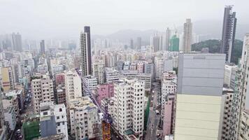 Hong Kong skyscrapers in haze, drone view video