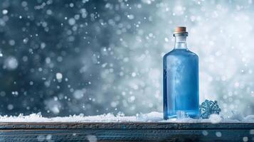 A blue gin bottle ona wooden surface in a snowy background. Generated by artificial intelligence. photo