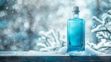 A blue gin bottle ona wooden surface in a snowy background. Generated by artificial intelligence. photo