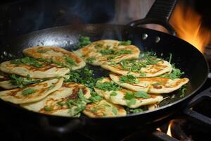 Frying flatbread filled with fresh herbs and cheese. Khychiny or qutab. photo