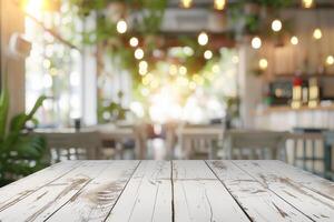 Top of white wooden table with blurred bokeh light and soft natural light in coffee shop. Copy space photo