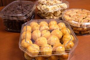 Various dried cakes on wooden table. After some edits. photo