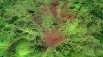 a green and red liquid is shown in this image video