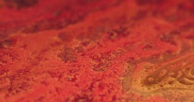 a close up of a red and orange surface video