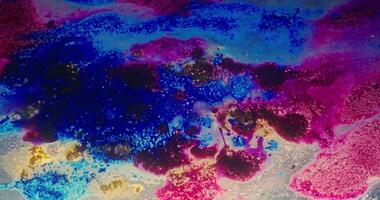 a colorful abstract painting with blue, pink and yellow video