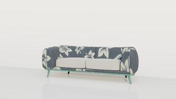A blue and white couch with a floral pattern photo