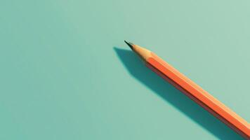 a pencil is sitting on top of a green surface photo