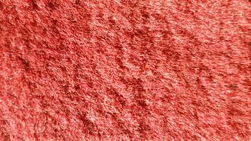 Red synthetic fabrics background, Background and Texture Concept photo