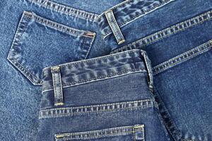 beautiful fashion jeans Stacked in layers at the jeans store photo