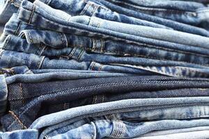 beautiful fashion jeans Stacked in layers at the jeans store photo