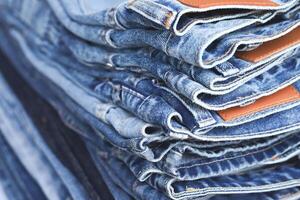 beautiful fashion jeans Stacked in layers at the jeans store photo