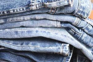 beautiful fashion jeans Stacked in layers at the jeans store photo