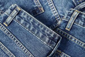 beautiful fashion jeans Stacked in layers at the jeans store photo