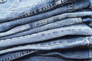 beautiful fashion jeans Stacked in layers at the jeans store photo