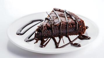 a piece of brownie cake with melted chocolate on a white plate on a white background photo