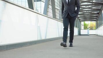 Confident guy in suit being on his way to work. Cityscape background video