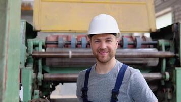 Portrait of a professional worker in an industrial workshop. The concept of heavy industry video