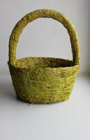 Woven Basket Made From Wicker, Herbal Fibers And Threads Isolated On White photo