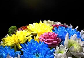 Bouquet Of Colorful Flowers In Darkness Detailed Side View Photo