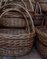 Traditional handicraft. Woven baskets with braided handles photo