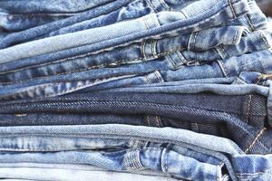 beautiful fashion jeans Stacked in layers at the jeans store photo