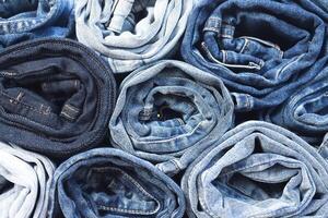 beautiful fashion jeans Stacked in layers at the jeans store photo