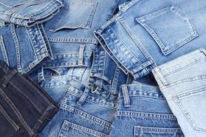 beautiful fashion jeans Stacked in layers at the jeans store photo