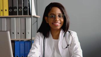 Portrait of confident skilled practitioner indian female physician in eyeglasses video