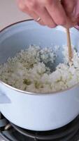 young woman making candles from soy wax video