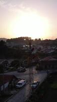 Vertical Video of Eletrician Working in the Pillow at Sunset Aerial View