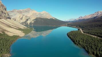 Aerial view of Bow Lake and the reflection of Mount Jimmy Simpson video