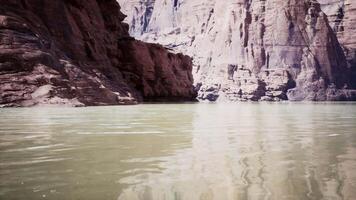 A breathtaking view of a serene lake nestled within towering cliffs video