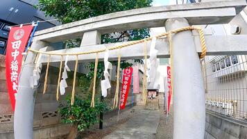 Torii of a shrine in a residential area Tanaka Inari Daimyojin,, 3-chome Shimotakaido, Suginami-ku, Tokyo, Japan The date of its establishment is unknown, but it is said to have been enshrined there photo