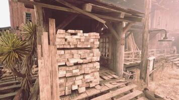 A stack of firewood next to a rustic building video