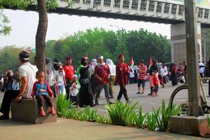Bekasi, Indonesia, 2023 - People walking on Sunday during the once-a-week Car Free Day. photo