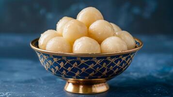 AI generated The rasgullas kept in a shallow bowl, dipped in sugar syrup.  Luxuious indian background. Plain deep navy blue background. Generated by artificial intelligence. photo